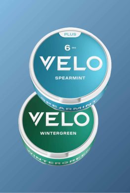 Image showing two cans of VELO nicotine pouches, one Wintergreen and one Spearmint
